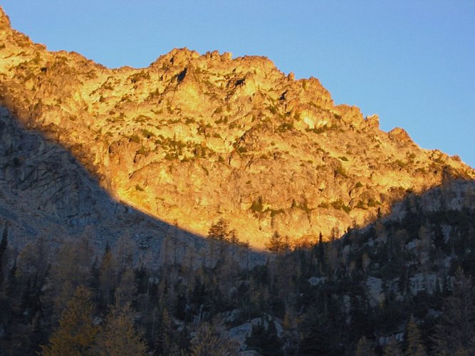 The final morning dawned clear with bright alpenglow above the Saska-Emerald Col.
